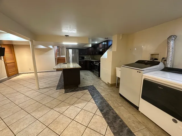 a kitchen with a stove and a refrigerator