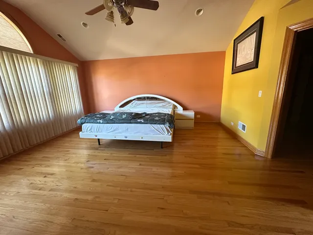 a view of a livingroom with furniture window and wooden floor