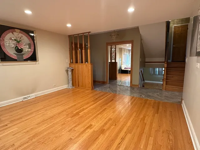 a view of a livingroom with wooden floor