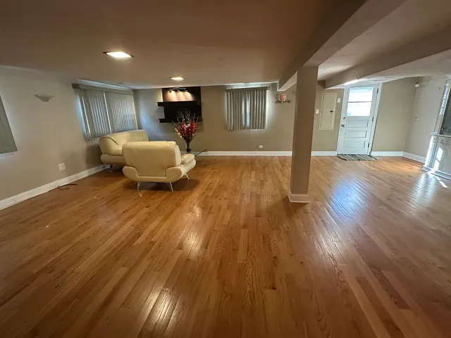 a bed room with wooden floor and furniture