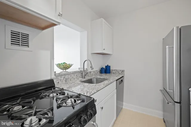 a kitchen with a stove and a refrigerator
