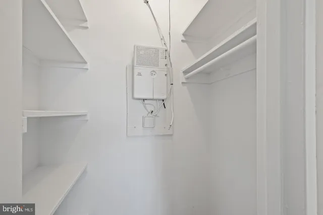 a bathroom with a sink toilet vanity and shower