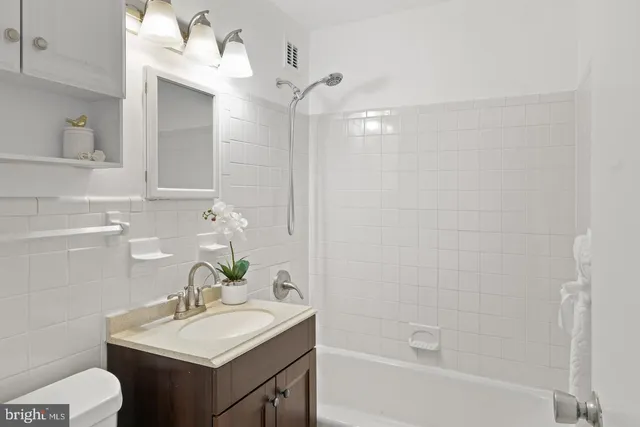 a utility room with multiple dryer and washer