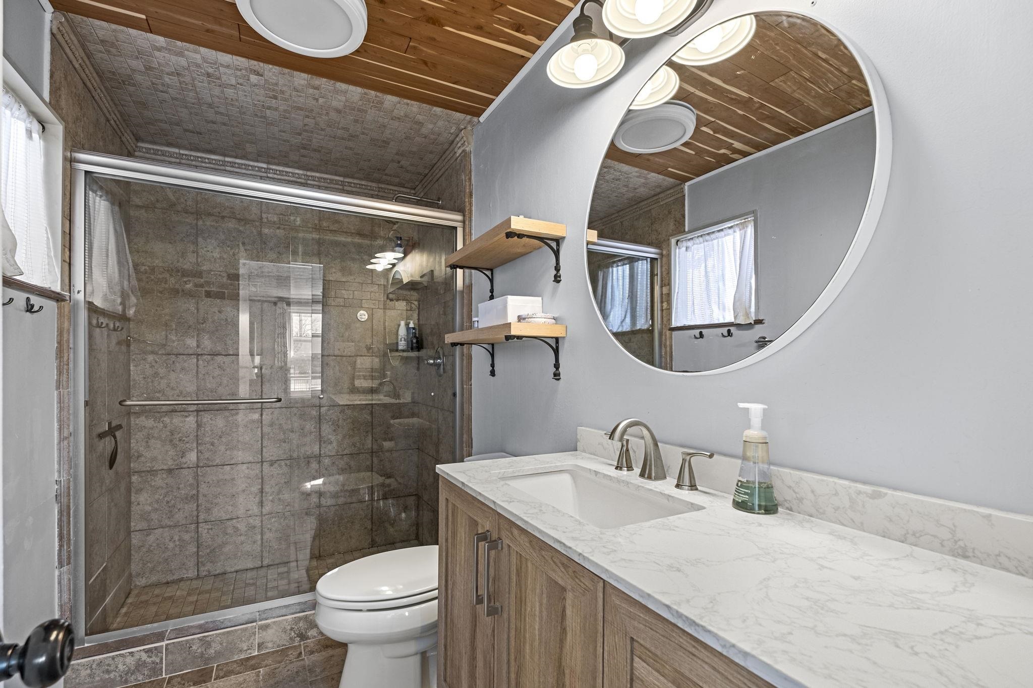 4120 Village Road Memphis, TN 38117 - Photo 16 of 28 Bathroom featuring vanity and a stall shower
