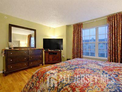 31 Edinburgh Court Edison, NJ 08820 - Photo 22 of 25 a bedroom with a bed and a flat screen tv