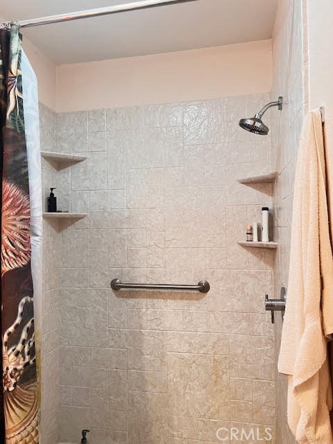 15542 Kiamichi Road Apple Valley, CA 92307 - Photo 20 of 39 a bathroom with a shower