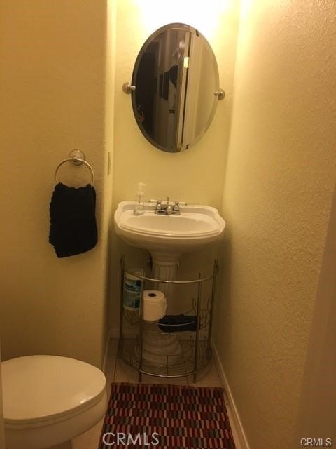 15542 Kiamichi Road Apple Valley, CA 92307 - Photo 21 of 39 a bathroom with a sink and a mirror