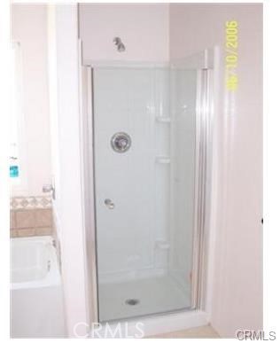 15542 Kiamichi Road Apple Valley, CA 92307 - Photo 25 of 39 a bathroom with a shower