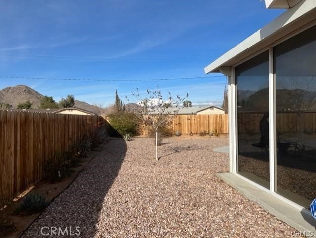 15542 Kiamichi Road Apple Valley, CA 92307 - Photo 35 of 39 a view of a house with a yard