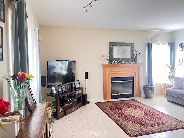 15542 Kiamichi Road Apple Valley, CA 92307 - Photo 5 of 39 a living room with furniture and a fireplace