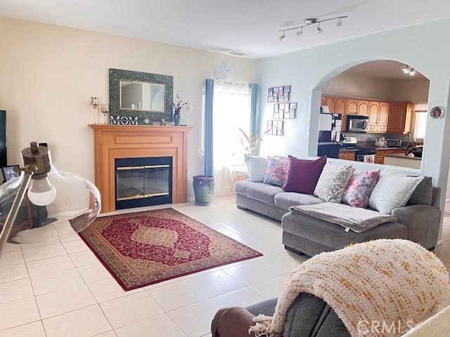15542 Kiamichi Road Apple Valley, CA 92307 - Photo 7 of 39 a living room with furniture and a fireplace