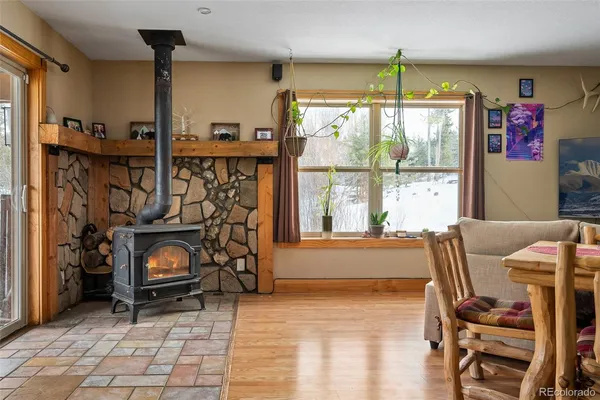 a living room with furniture a window and gym equipment