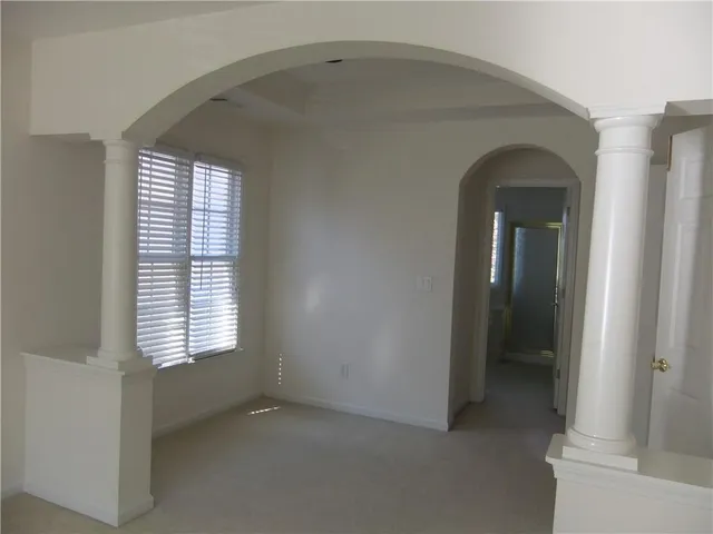 an empty room that has a window