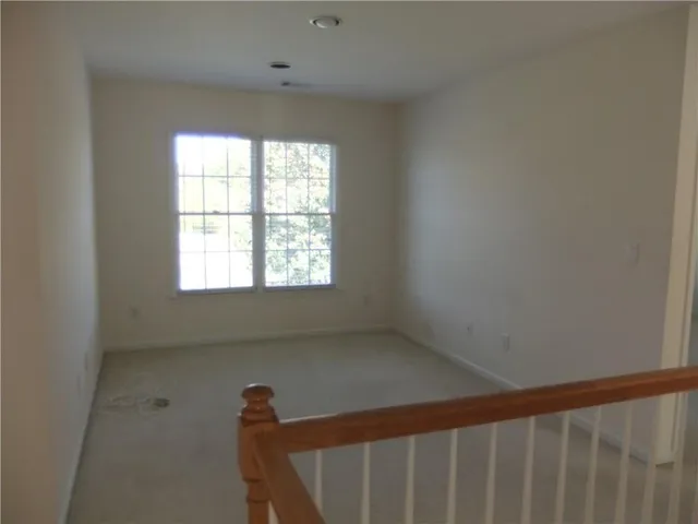 a view of a hallway with a window