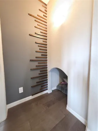 a view of closet with stairs