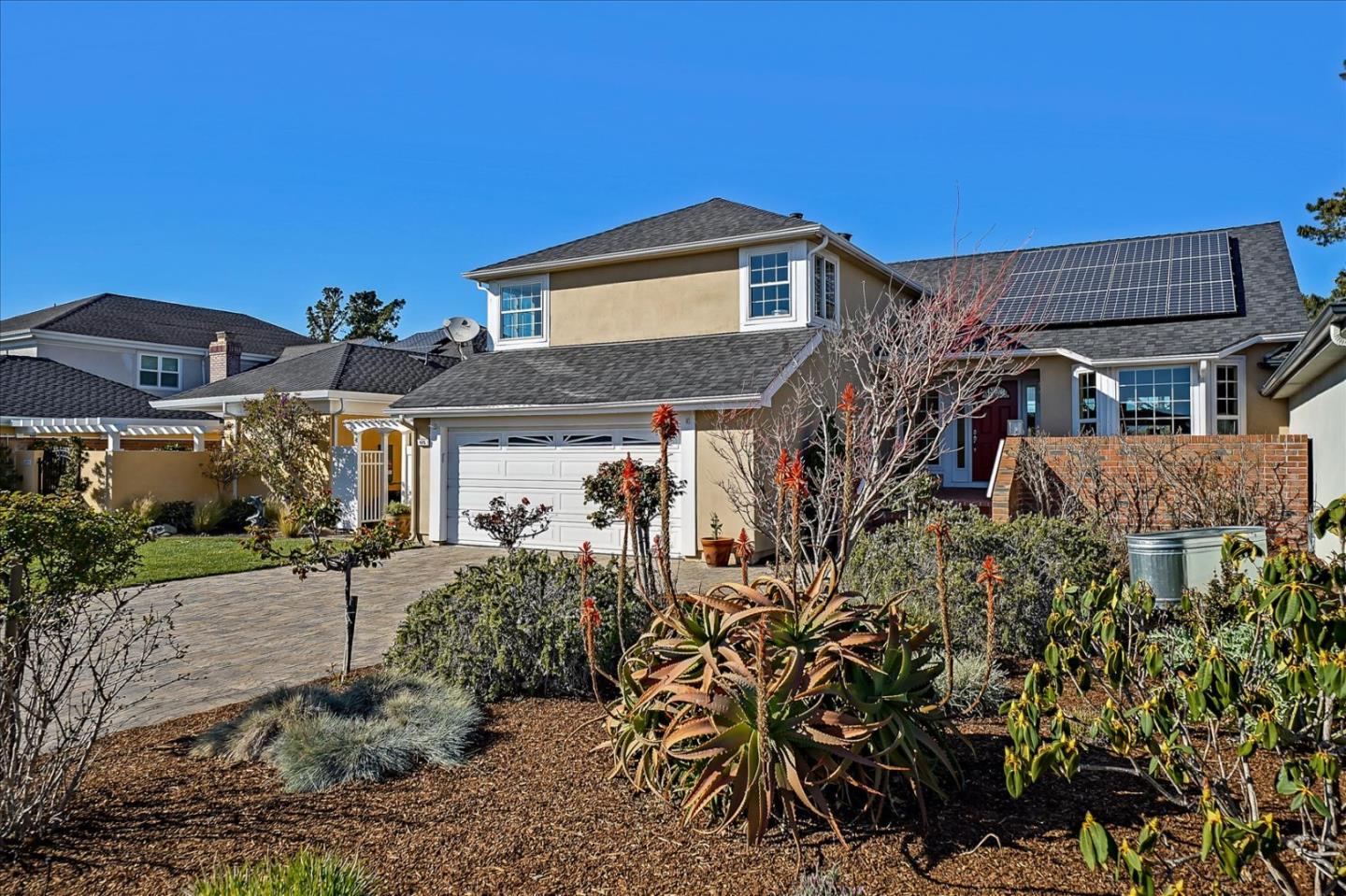 a front view of a house with a yard