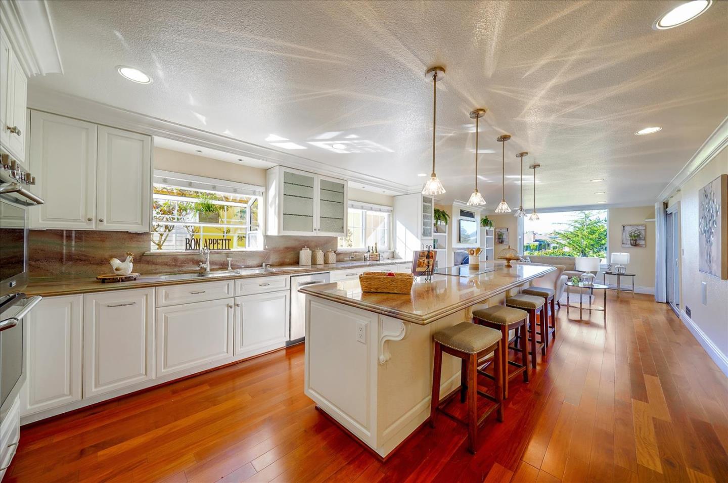 475 Winged Foot Road Half Moon Bay, CA 94019 - Photo 11 of 28 a kitchen with lots of counter top space and dining table