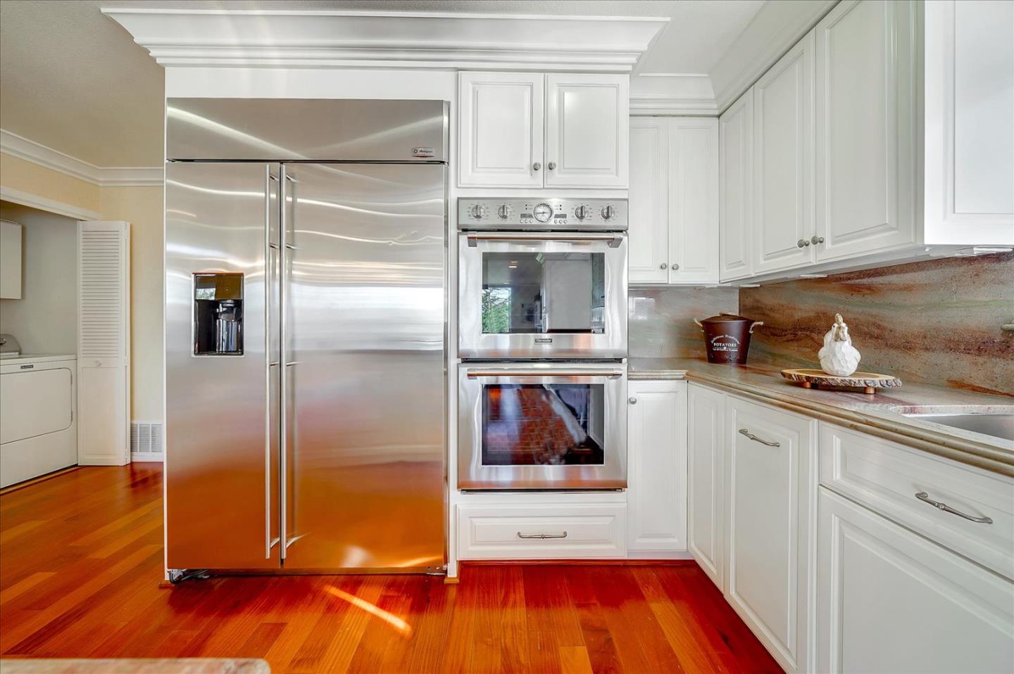 475 Winged Foot Road Half Moon Bay, CA 94019 - Photo 12 of 28 a kitchen with stainless steel appliances granite countertop a refrigerator and a stove