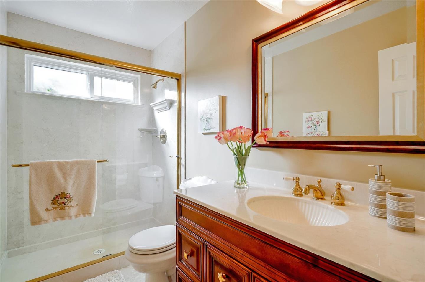 475 Winged Foot Road Half Moon Bay, CA 94019 - Photo 15 of 28 a bathroom with a granite countertop sink and a mirror with toilet