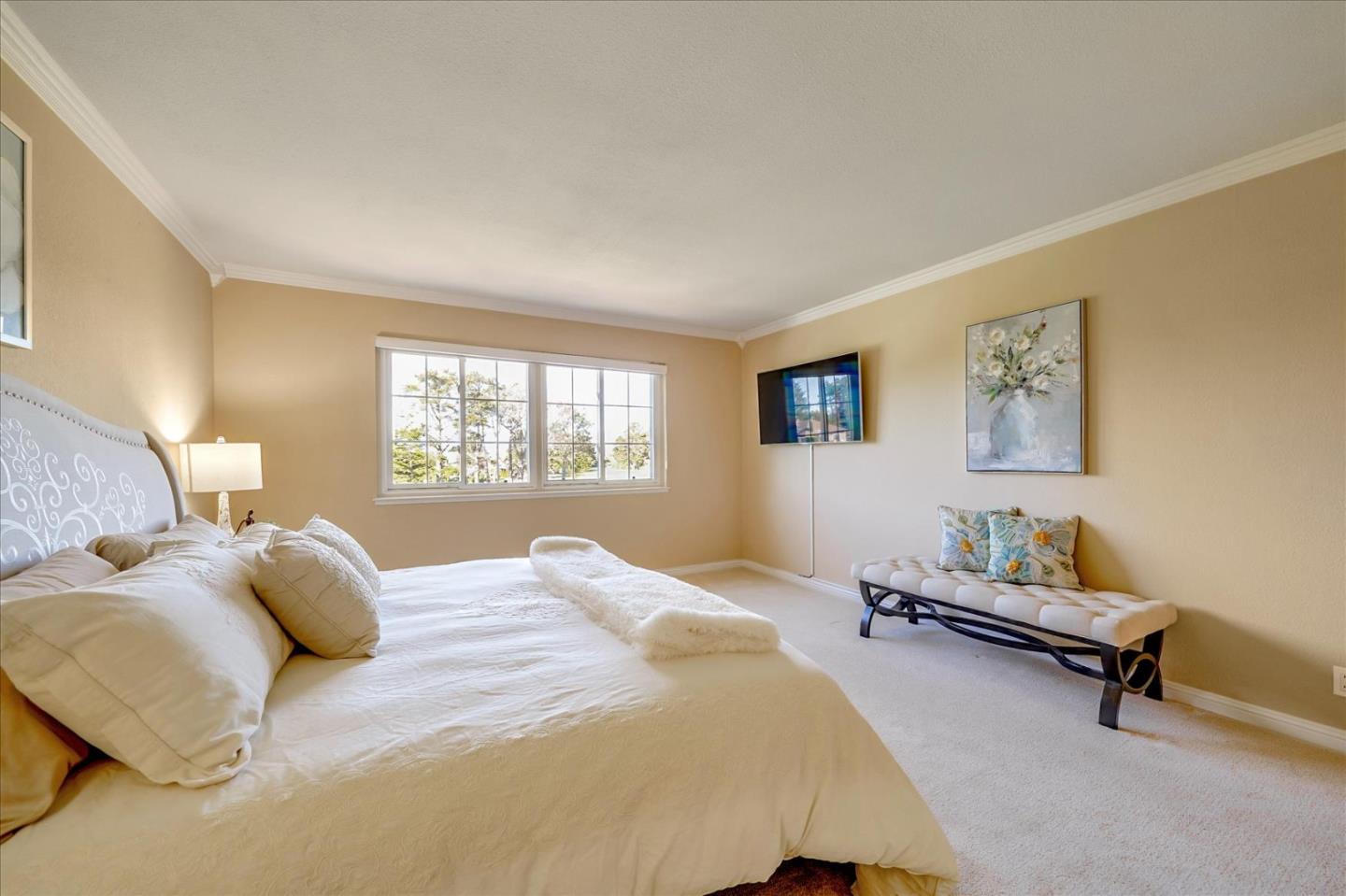 475 Winged Foot Road Half Moon Bay, CA 94019 - Photo 19 of 28 a bedroom with a bed and a window