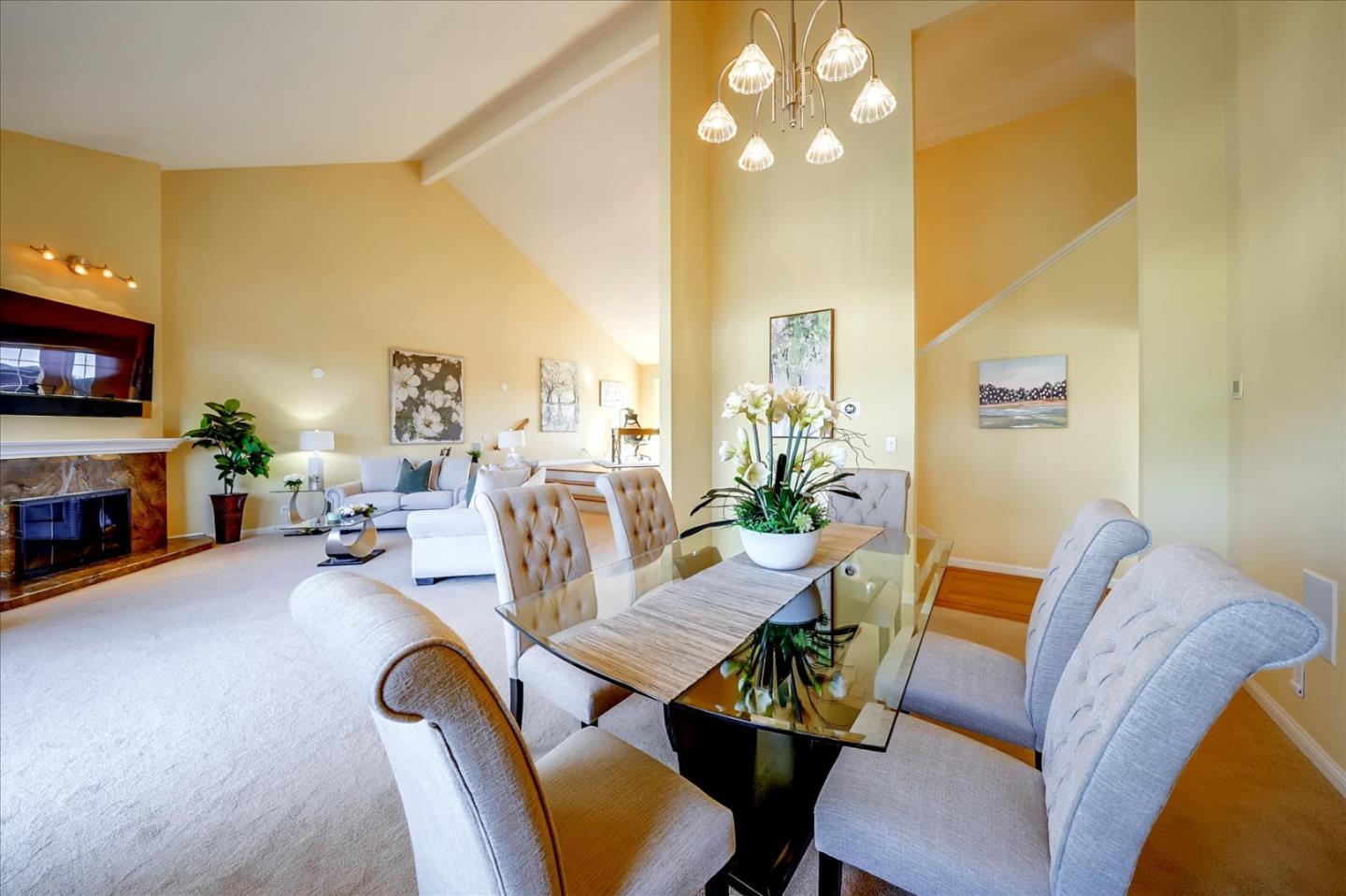 475 Winged Foot Road Half Moon Bay, CA 94019 - Photo 4 of 28 a living room with furniture a fireplace and a flat screen tv