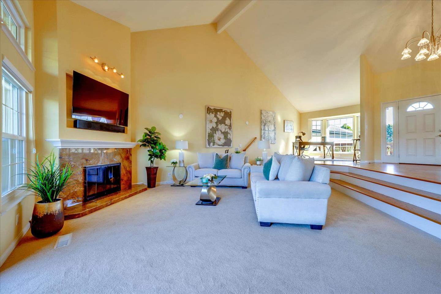 475 Winged Foot Road Half Moon Bay, CA 94019 - Photo 6 of 28 a living room with furniture a fireplace and a flat screen tv