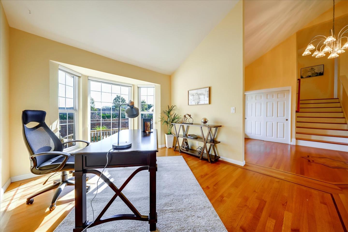 475 Winged Foot Road Half Moon Bay, CA 94019 - Photo 7 of 28 a living room with furniture and a wooden floor