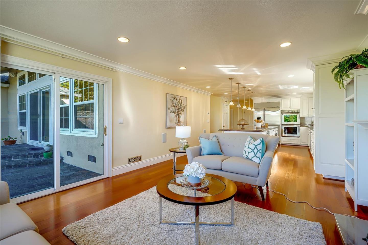 475 Winged Foot Road Half Moon Bay, CA 94019 - Photo 8 of 28 a living room with furniture and a wooden floor