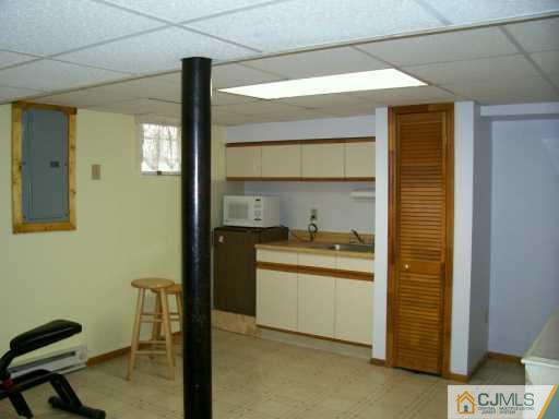 11 Montview Road Edison, NJ 08837 - Photo 6 of 8 a kitchen with a sink cabinets and a window