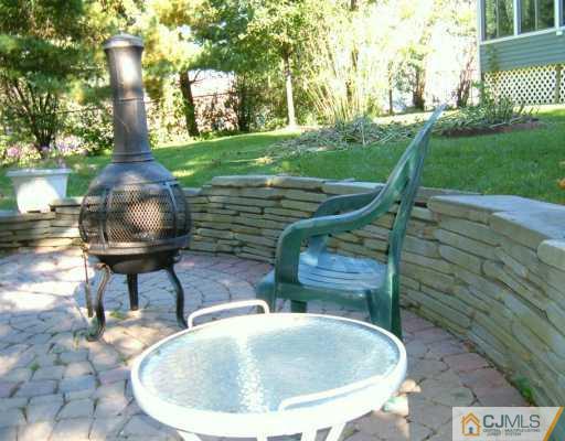 11 Montview Road Edison, NJ 08837 - Photo 7 of 8 a view of a fountain in the yard with a fountain