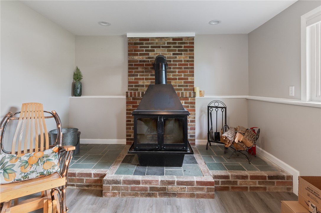 218 Kusak Road Henrietta, NY 14467 - Photo 20 of 33 Wood burning stove with plenty of space for tools