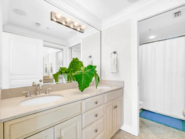 a bedroom with a large bed and a large window