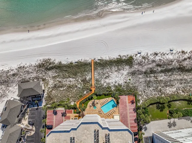 a view of building with swimming pool and sitting space