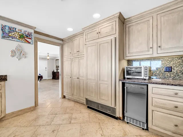 a view of a swimming pool with outdoor seating