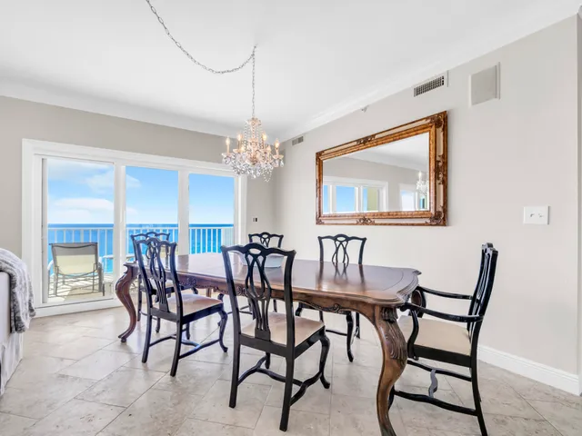 a view of a dining room with furniture window and outside view