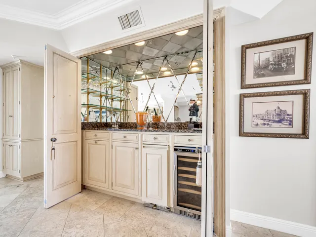 a bedroom with a bed a couch and a large window