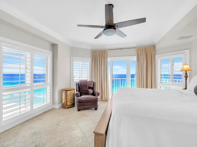 a bedroom with a bed and a couch