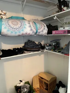 a room with a stove and cabinets