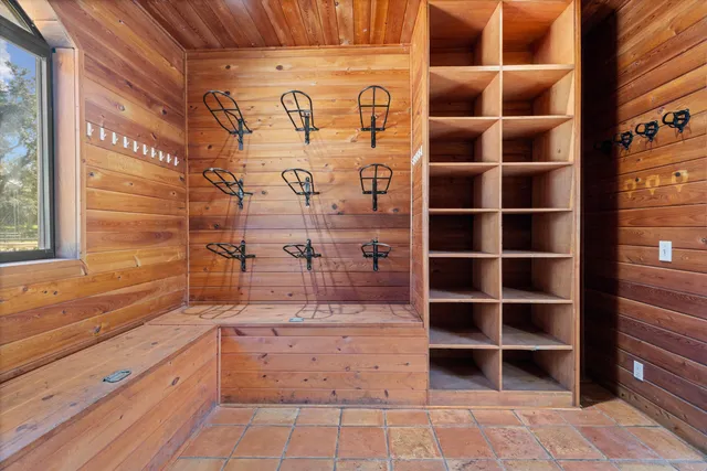 a view of walk in closet with empty racks