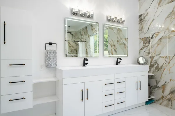 a living room with furniture pool table and flat screen tv