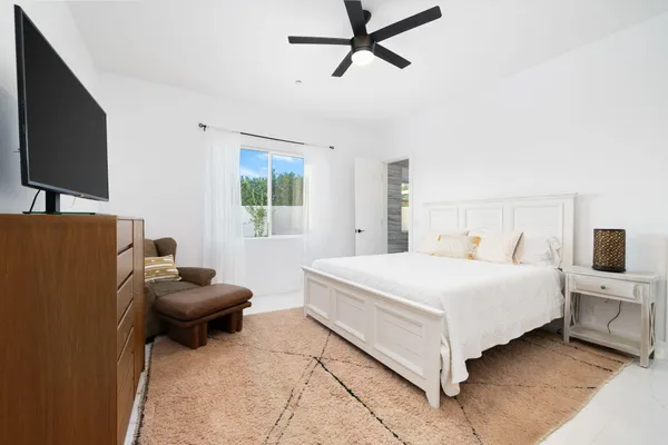 a living room with furniture and kitchen view