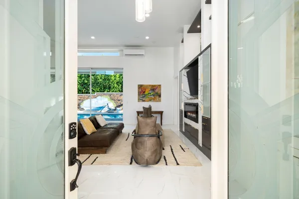 a view of kitchen with furniture and wooden floor