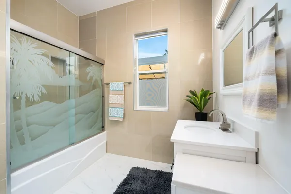 a living room with furniture rug and wooden floor