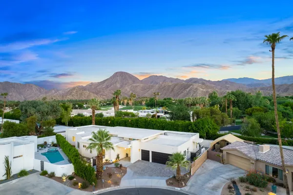 a kitchen with stainless steel appliances kitchen island a sink and cabinets