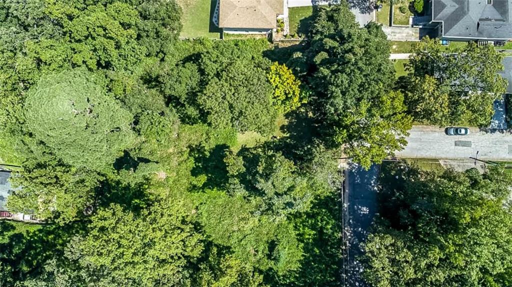 1427 Andrews Street Northwest Atlanta, GA 30314 - Photo 7 of 8 an aerial view of residential house with outdoor space and trees all around