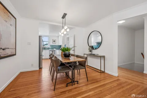 a kitchen with a refrigerator sink and stainless steel appliances