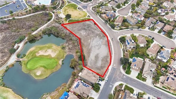 an aerial view of a house with a swimming pool