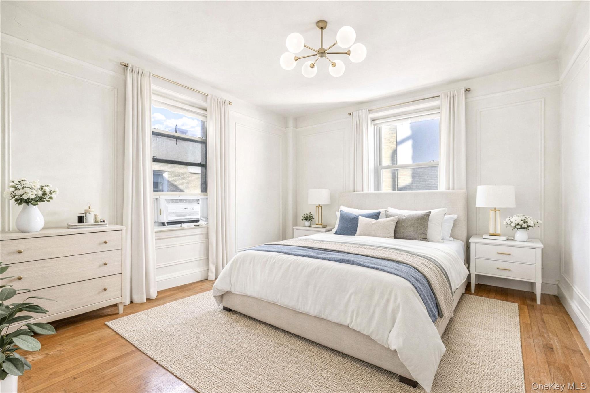 390 Riverside Drive, Unit 15D Manhattan, NY 10025 - Photo 15 of 29 Bedroom featuring a chandelier and light wood-style flooring