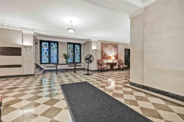 a lobby with a black white checkered floor and a black white checkered floor