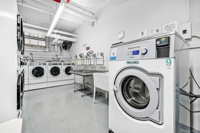 a roof deck with table and chairs and wooden floor